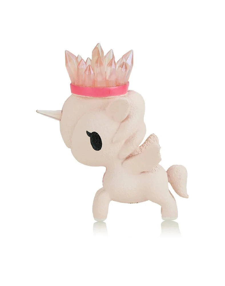 Tokidoki Precious Unicorno - Pink Aura Amethyst (Special Edition) figurine features wings, a silver horn, and a translucent pink crystal crown, inspired by Pink Aura Amethyst, shown in profile on a white background.