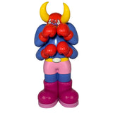 The Little Hut’s Lazy Boxer (OG) is an 8-inch cartoon-style collectible figure with four arms, red gloves, yellow horns, a blue body, pink shorts, and big purple boots, displayed against a white background.