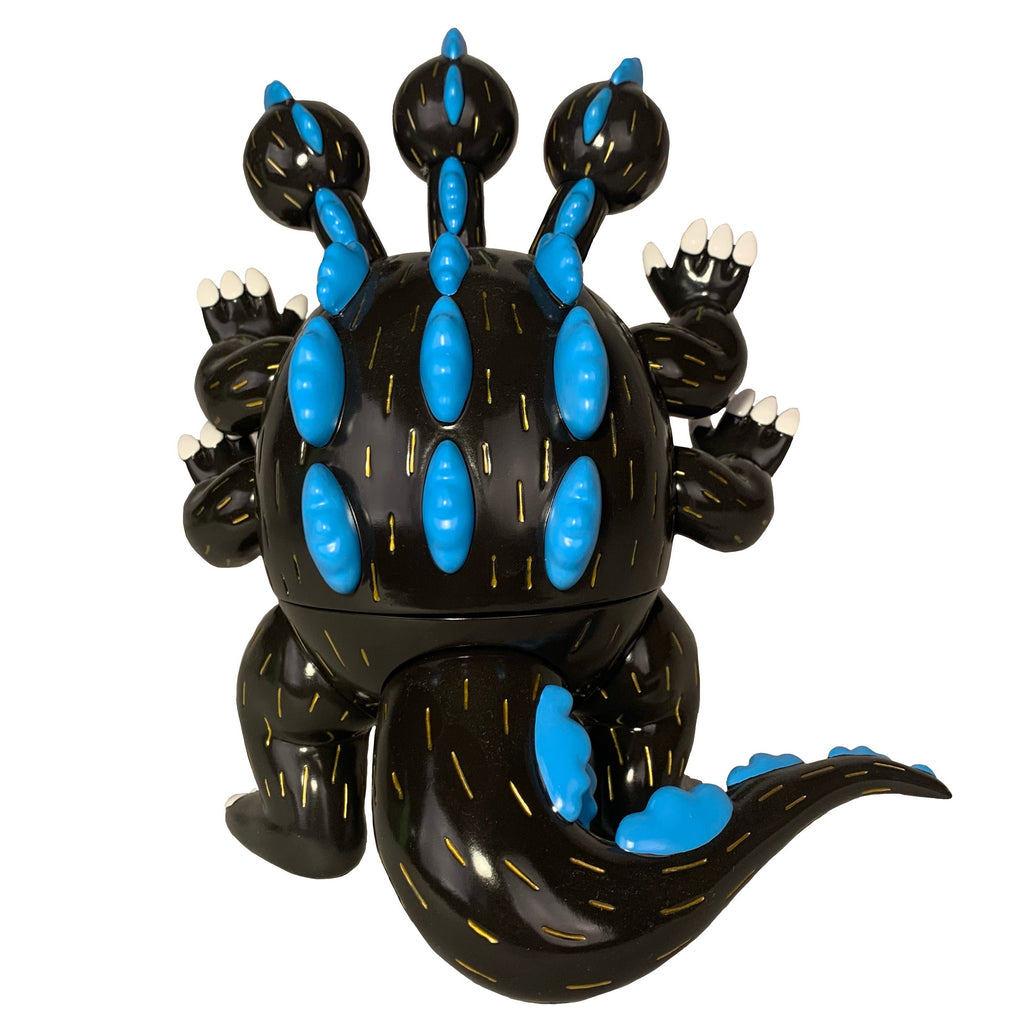 The Little Hut / Paradise Toys Dinosuke - Black vinyl figure features multiple heads, blue spikes, six arms, a thick tail, and white claws, all in black, displayed against a white background.