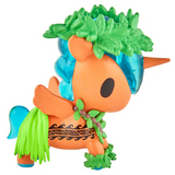 An orange unicorn figurine from the tokidoki Hawaiian Ohana Blind Box, with a blue mane and tail, green leaf accents, black markings, and a cute green grass skirt—ideal for fans of tropical-themed collectibles by tokidoki.