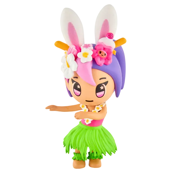 A tokidoki Hawaiian Ohana Blind Box figure with purple-pink hair, bunny ears, flower accents, green grass skirt, and pink star eyes—posed as if hula dancing—ideal for fans of tokidoki tropical collectibles.