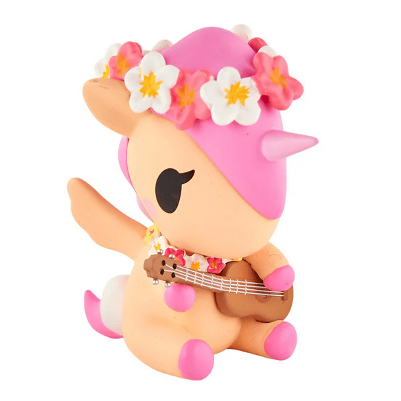 The tokidoki Hawaiian Ohana Blind Box features a cute Unicornos figurine with a pink mane, flower crown, and brown ukulele—an adorable collectible for fans of tokidoki’s tropical-themed items.