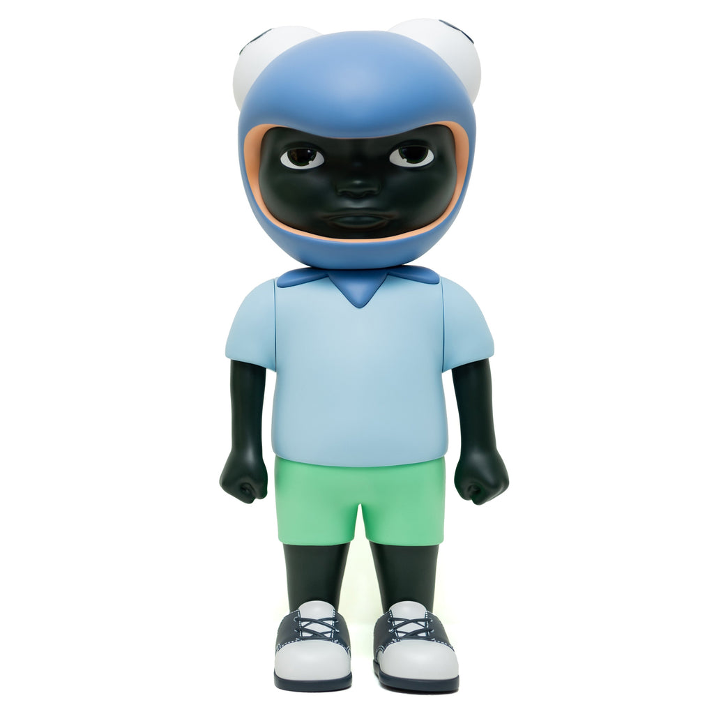 Phibby — Purple by Hebru Brand is a limited edition vinyl figure with dark skin, a light blue shirt, green shorts, sneakers, and a blue frog-shaped helmet.