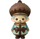 The VAG 45—Monchhichi Happy Gift Box by Medicom is a charming Japanese vinyl toy featuring a smiling character with gray hair, a brown and gold crown, teal-brown outfit with bow, and brown shoes—perfect for gachapon collectors.