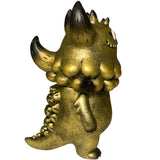 The Little Hut's Rangeas Jr. - Gold Patina figure features a horn, textured back, and one visible arm in striking gold and black—an eye-catching collectible displayed on a white background for enthusiasts.