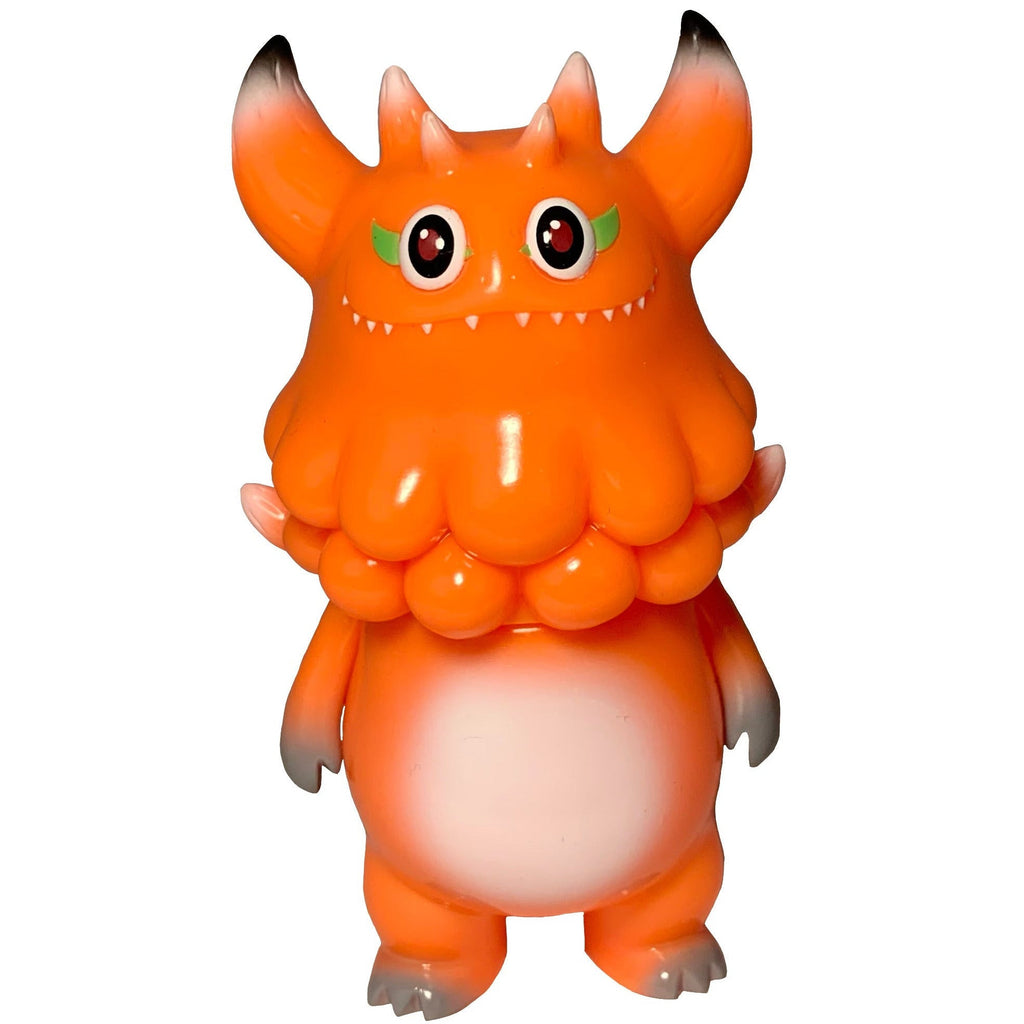 The Little Hut’s Rangeas Jr. - Orange features two horns, red eyes, green eyelids, sharp teeth, a puffy neck, and a white belly—an upright collectible monster figurine for enthusiasts.