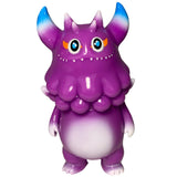 The Little Hut’s Rangeas Jr. - Purple features blue-tipped horns, orange eyebrows, big round eyes, and a white belly—an upright collectible figurine perfect for monster fans.