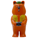 Mamechan - #1 by Paradise Toy: a plastic bear figurine standing upright, wearing a green hat and yellow vest, holding a camera with a surprised look—an ideal tourist collectible for your collection.