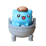 The Bugcat Capoo — National Palace Museum Adventure Blind Box by Partner Toys features a blue Capoo figurine with a brown hat sitting in a gray, Greek key-patterned bowl—perfect for blind box and collectible lovers.