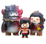 The Little Hut’s Lucas-Starbeast Adventure set includes three stylized vinyl figures: a large spiky monster, a small star-armed creature, and a horned child in a red striped shirt, posed together in striking silhouette.