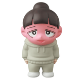 A pink-faced cartoon figure with dark hair in a bun, wearing a light gray hoodie and pants, stands against a white background—Medicom’s Vag 35 - Inu No Kagayaki is the perfect quirky office gift or playful desk decor.
