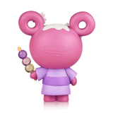 A limited edition Tokidoki x Hello Kitty Series 3 figure by tokidoki features a pink, bear-like character in purple attire, upright and holding a skewer with three colorful dango balls—full of playful tokidoki charm.