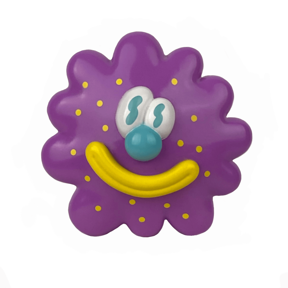 The Partner Toys Virus Flower is a playful, flower-inspired purple spiky circular toy with yellow dots, a big yellow smile, blue nose, and cartoon eyes. It measures 3.5 inches across and resembles a cheerful virus flower.