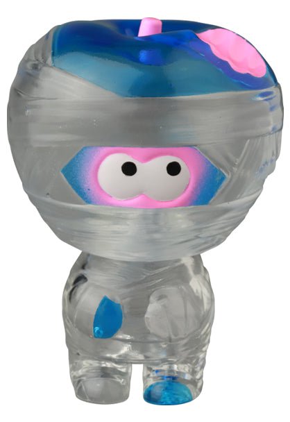 The VAG 41 — Yummy Mummy by Medicom is a small, transparent plastic figurine with a blue and pink headband and large cartoon eyes, inspired by Japanese vinyl toy styles commonly seen in gachapon figures.