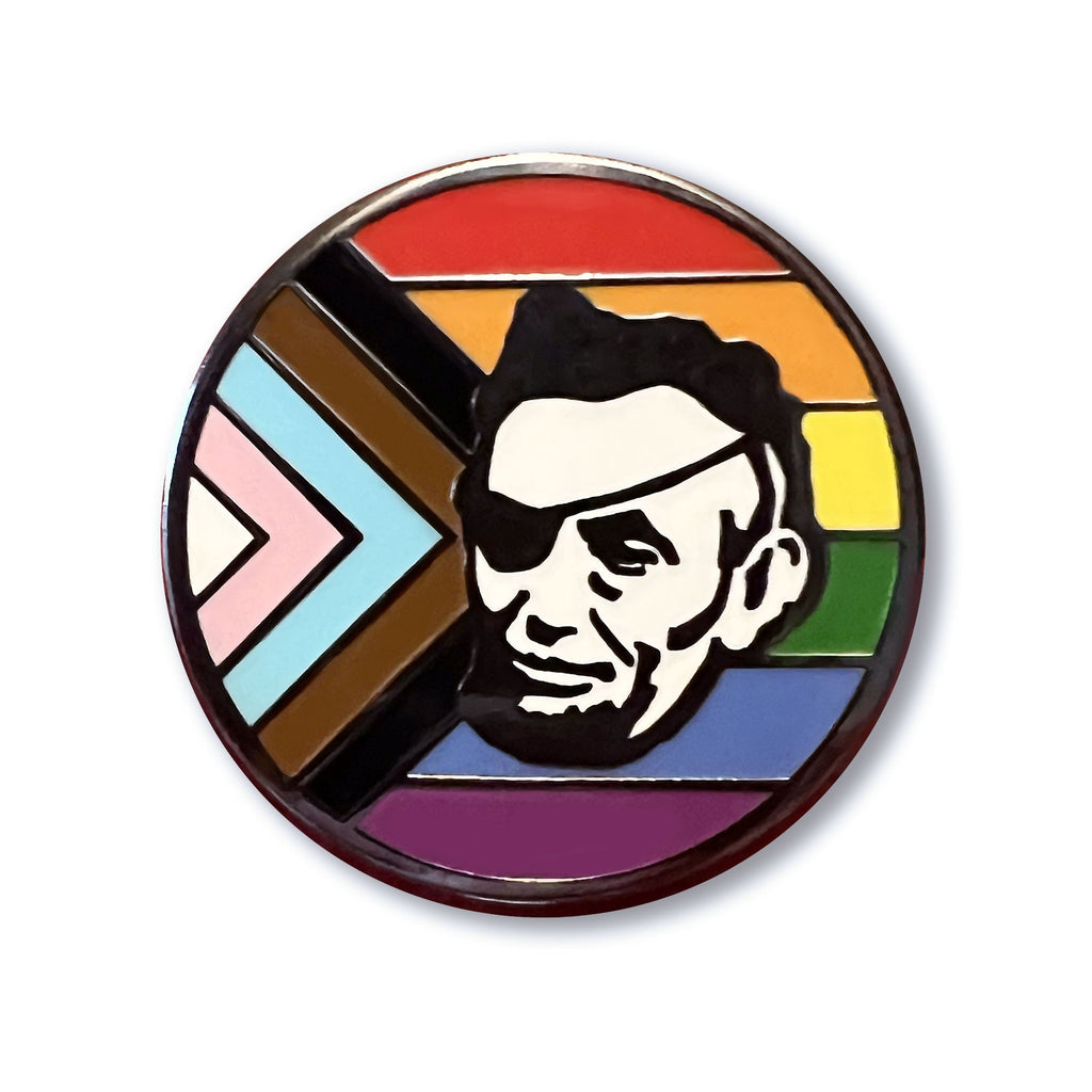 Show your support at any LGBTQ+ Center event with the Rotofugi Abe Progress Pride Hard Enamel Pin by Rotofugi—a round pin featuring a black and white portrait with an eye patch over a vibrant Progress Pride flag.