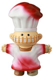 The Medicom VAG 39 — Butcher is a Japanese vinyl toy chef with a white and red hat, stitched mouth, and outstretched arms—part of the Vinyl Artist Gacha gachapon figures collection.