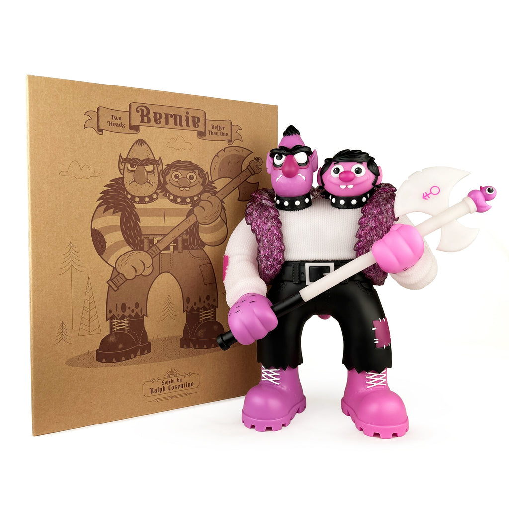 The Bernie — Purple Reign Rotofugi Exclusive by UFO Toys is a two-headed sofubi figure with an axe, glow-in-the-dark details, and comes in front of a matching illustrated box.