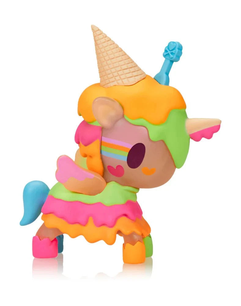 The tokidoki Ice Cream Shop Unicorno - Neon Melty (Special Edition) is a colorful toy figure with an ice cream cone hat, rainbow stripes, heart-shaped face accents, and neon melty details, shown on a white background.