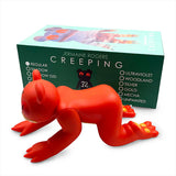 Red bear-like Creeping Dero — Original vinyl figure by Jermaine Rogers stands on all fours in front of its box, representing the unique character from the acclaimed Jermaine Rogers collection and offered in various collectible color options.