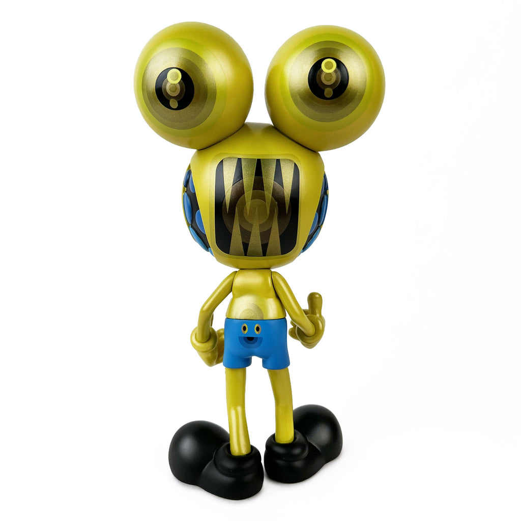 The Dalek Space Monkey — Gold Rotofugi Exclusive by UVD Toys features a yellow cartoon figure with large eyes, pointed teeth, blue shorts, and black shoes, standing against a white background—an exclusive vinyl toy.