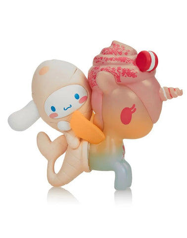 The tokidoki x Cinnamoroll Sweet Treats - Cinnamoroll x Mango'licious (Special Edition) features a cute ice cream cone character riding a unicorn with pink frosting and a candy horn, capturing tokidoki's whimsical style.