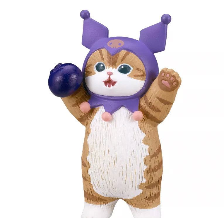 A brown and white cartoon cat figurine in a purple hat, resembling Mofusand kitties, from the Kitan Club Mofusand x Sanrio Series 2 Capsule collection, with one paw raised and holding a dark round object.