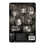 Black and white illustration of six framed portraits, including Marilyn Munster, on a cobwebbed wall. Features The Munsters ReAction - Marilyn figure by Super 7, with