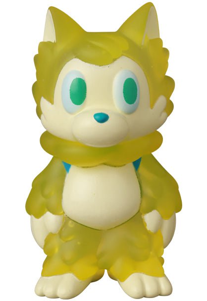 The Medicom Ookamikun — VAG 10th Anniversary is a yellow, cartoon-style wolf vinyl toy with big blue eyes and a fluffy tail, capturing the cute Japanese gachapon figure charm.