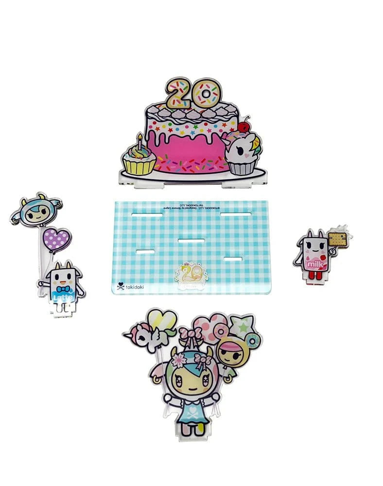 The tokidoki 20th Anniversary Acrylic Standee Blind Box features cute cartoon animals, a cake with “20” candles, and character accessories on a blue checkered base—all celebrating tokidoki's 20th anniversary.