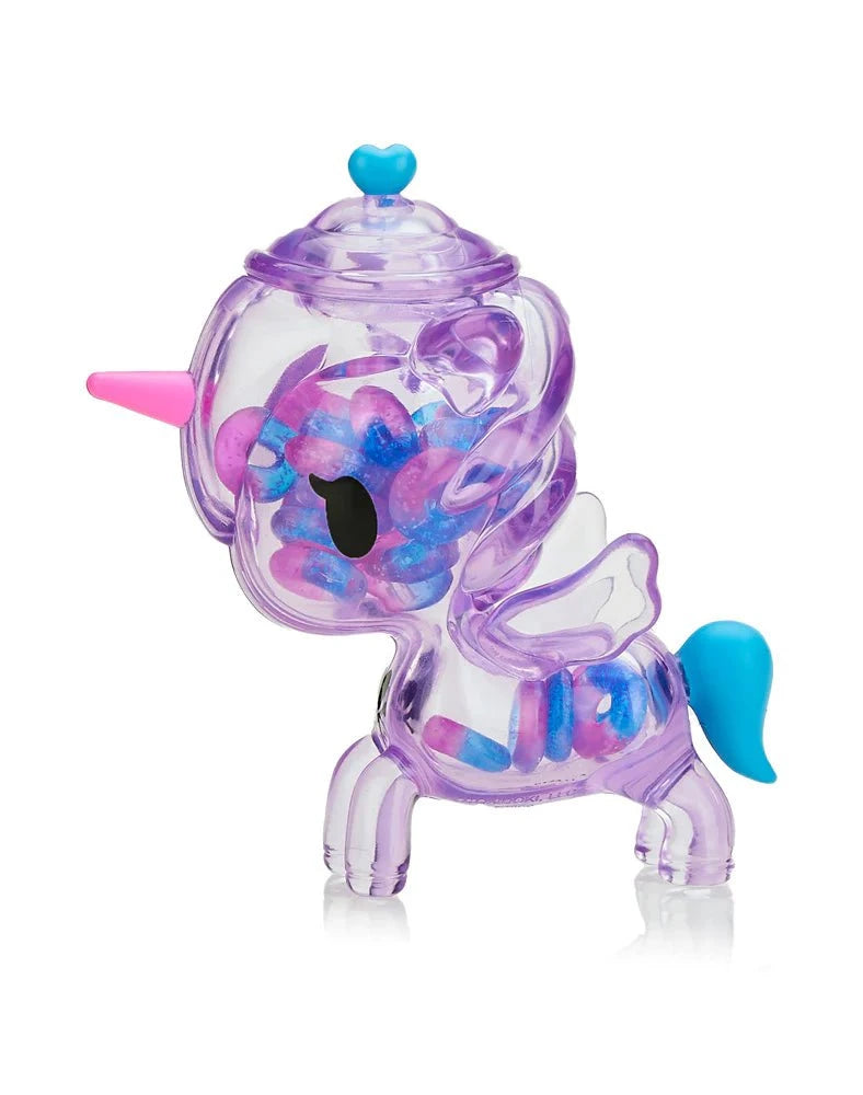 The tokidoki Sugar Shop Unicorno - Very Berry (Special Edition) is a translucent purple container with a pink horn, blue tail, wings, and heart-shaped knob—ideal for storing your favorite berry gummy rings.