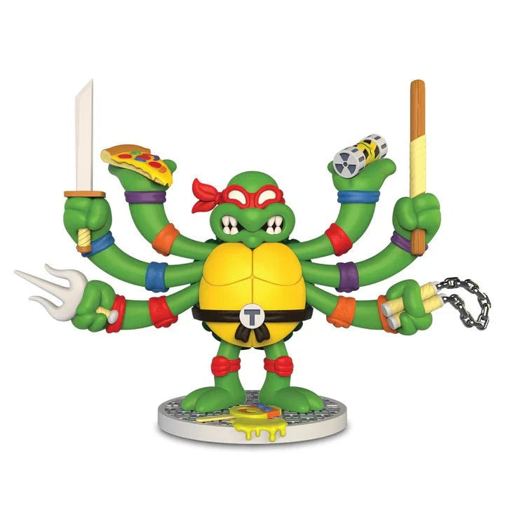 The Kidrobot Teenage Mutant Ninja Turtles TMNT GURU Resin Figure by CHOGRIN features a six-armed TMNT on a base, wielding ninja weapons and pizza, with a red mask plus each turtle’s colored wristbands.