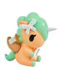 The tokidoki Fortune Cookie Unicorno Blind Box features a small orange and mint green unicorn figure with a white horn, winged saddle, bandage bow, and scroll—perfect for any Blind Box collection.