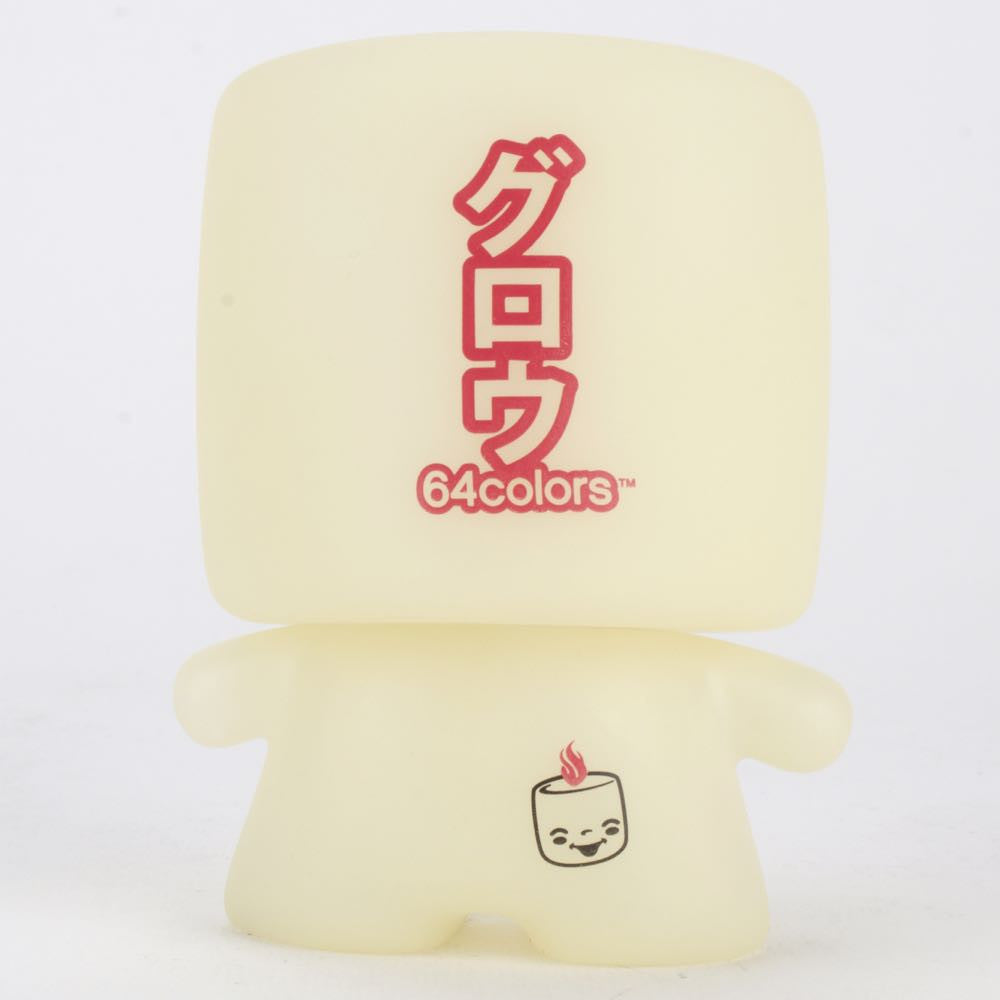 Grim Marshall by 64 Colors is a small, pale yellow, limited edition figure from Squibbles Ink + Rotofugi, with a square head featuring Japanese text and