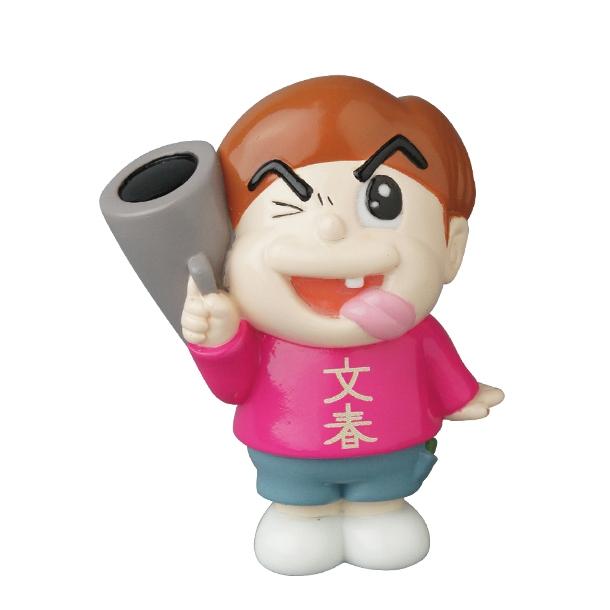Vinyl Artist Gacha Series 13 - Fumharu Kun by Medicom: A cartoonish toy with brown hair, pink shirt with white Chinese characters, blue shorts, holding a gray object, winking and sticking out its tongue.
