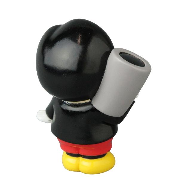 The Vinyl Artist Gacha Series 13 - Fumharu Kun by Medicom features a black cartoon figure with yellow shoes, red shorts, and a gray cylinder on its back—an eye-catching collectible for any figure collection.