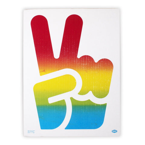 The DDC Peace Fingers Sign by Draplin Design Co. features a large hand making a peace sign in a red, yellow, and blue gradient with a distressed print style on a white background.