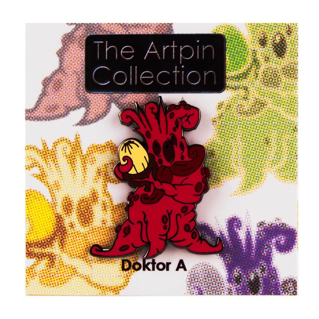 A red cartoon creature holds a yellow Mandrake Root pin on a card labeled