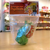 The Popsoda Finger Puppet - Clear Green by Pop Soda, packaged in plastic with a red and brown