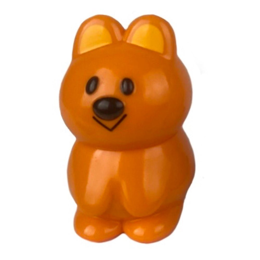 The VAG 33 - Kuokka Chan by Medicom is an orange plastic toy figure with black eyes, a black nose, and simple features, resembling Japanese vinyl gachapon animals like bears or rabbits.