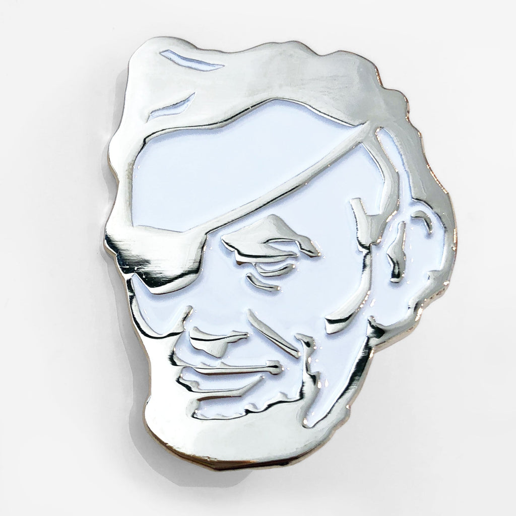 The Rotofugi Pirate Abe Enamel Pin by Rotofugi features a silver and white minimalist outline of Abraham Lincoln with an eyepatch—an ideal quirky mascot pin for any designer toy store.