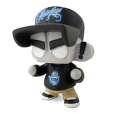 Limited edition Mad*L Citizen — Rotofugi Mad Ape vinyl by UVD Toys, featuring a large black cap, blue graphic hoodie, tan pants, white shoes, and oversized head—an essential designer toy for collectors.