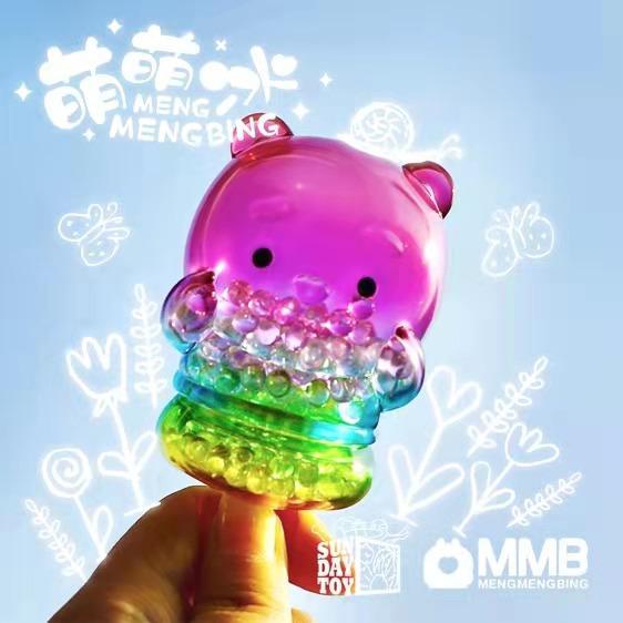 A hand holds a colorful, translucent Panda Popsicle Mini-Figure from Sun Day Toy’s Meng Meng Bing series, with white doodles and the text