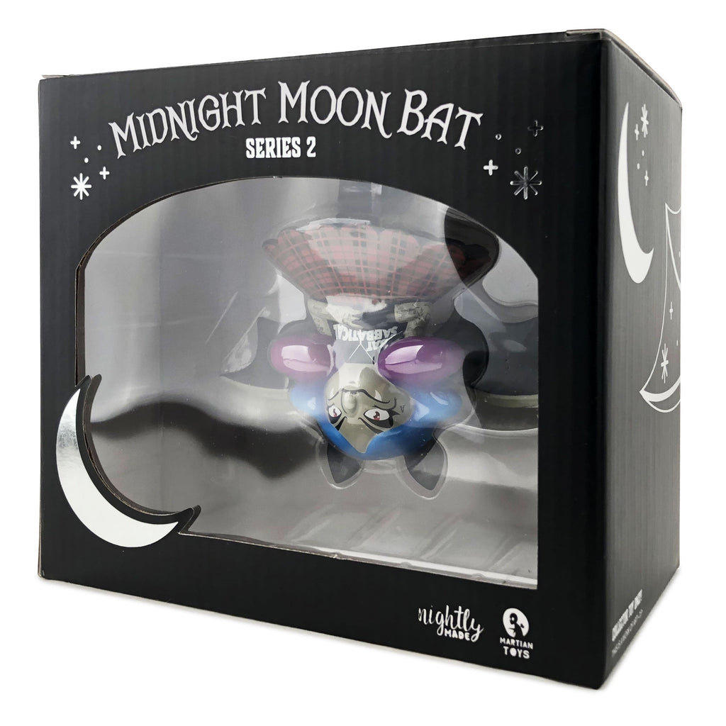 A Martian Toys Midnight Moon Bat — Bat Sabbatical w/ Free Print collectible is shown in black packaging with moon and star designs, plus a clear front window.