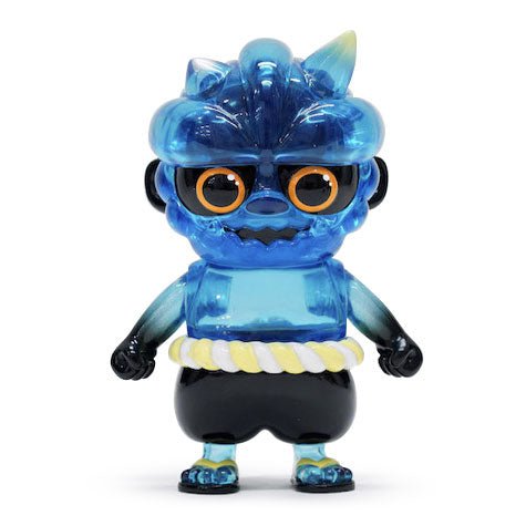 Oniki — Clear Blue by How2Work is a blue translucent sofubi vinyl toy inspired by Japanese yokai, featuring large round eyes, black glasses, a rope belt, black gloves, and black shorts in an upright pose.