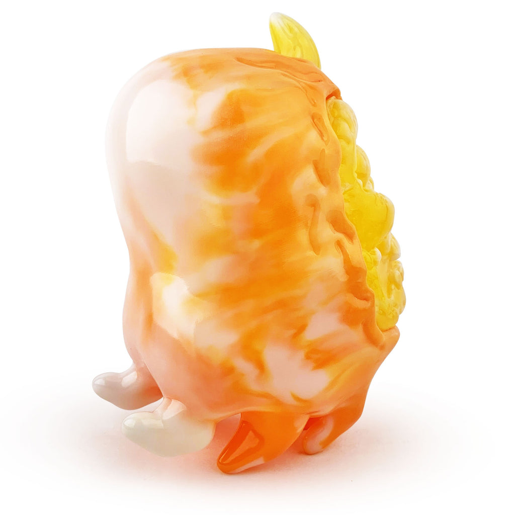 The Skully Ghost — Candy Corn by Squibbles Ink is a small, glossy orange and yellow abstract figurine with three stubby legs and textured details on one side, featuring a rounded candy corn-inspired shape, set against a white background.