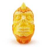The Skully Ghost — Candy Corn by Squibbles Ink is a playful yellow and orange plastic toy shaped like a horned skull with exaggerated features, perfect for spooky fun.