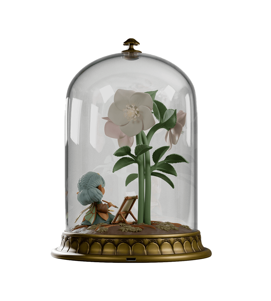 The Cloche Fairies — Hellie by Kaleidos Creative features a small hellebore fairy figure inside a glass dome with a large white flower and green leaves on a decorative base, creating a charming fairy lantern.