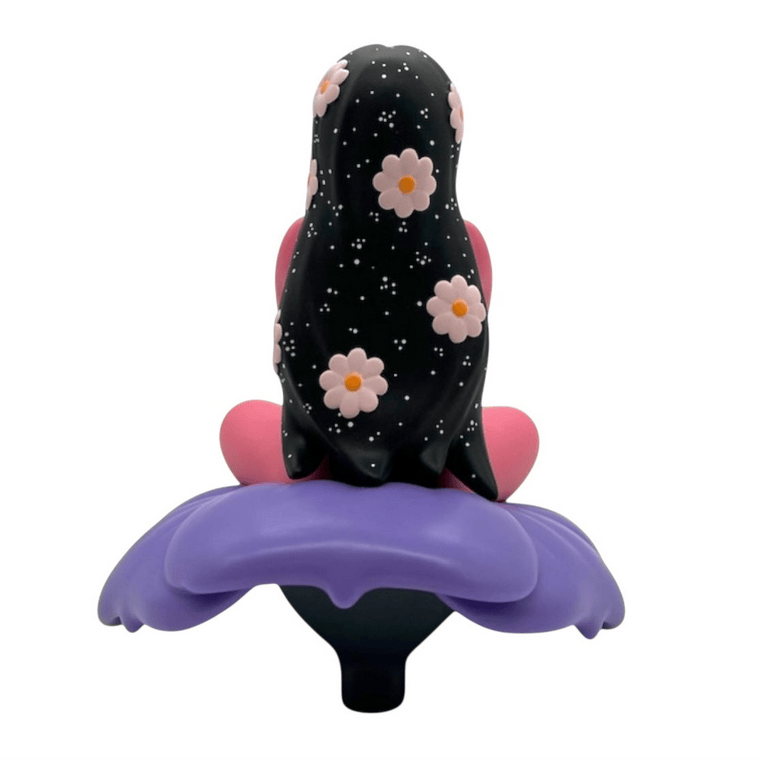Flower Girl by UVD Toys is a collectible figure featuring a seated character with long black hair, decorated with flowers and stars, resting on a large purple flower—perfect for collectors.