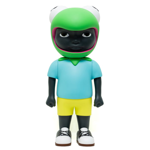 Phibby — OG (Green) by Hebru Brand is a limited edition collectible featuring a child with dark skin in a green frog helmet, blue shirt, yellow shorts, and white sneakers, standing forward.