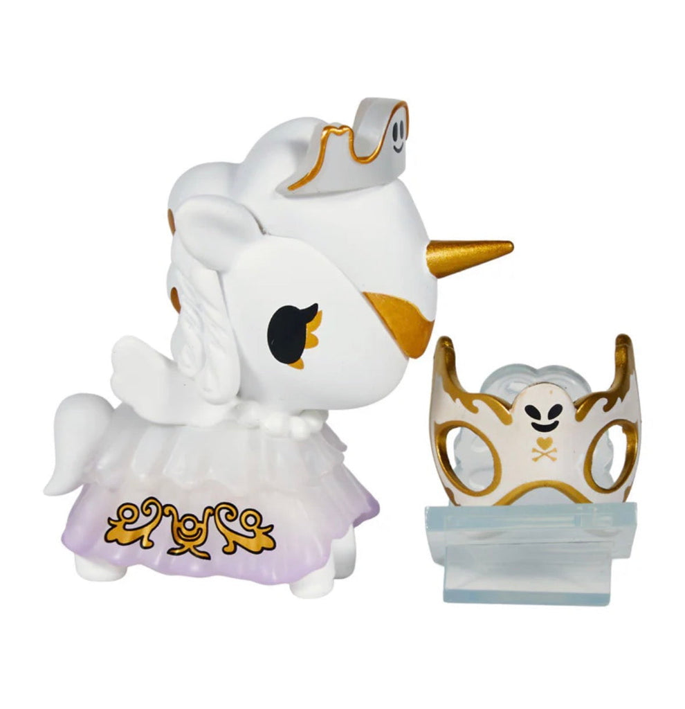 The tokidoki Unicorno After Dark Masquerade Blind Box features a striking white Unicorno figurine with gold accents and a decorative mask, displayed on a stand—an ideal collectible for any Blind Box fan.